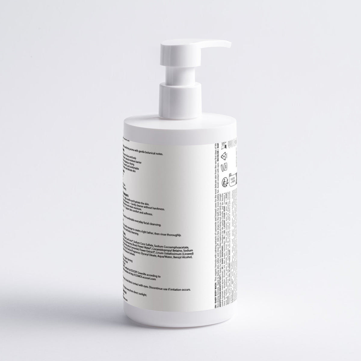 A white pump bottle with black text on the side, photographed against a clean white background.