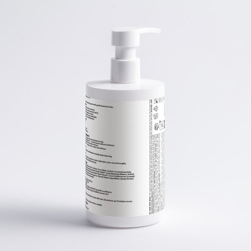 A white pump bottle with black text on the side, photographed against a clean white background.